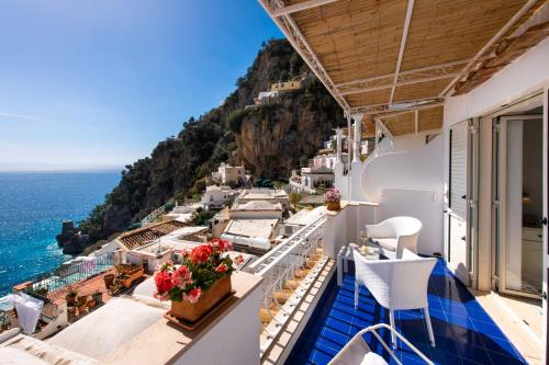 
a boat sitting on top of a pier next to a beach at Casa Guadagno in Positano
