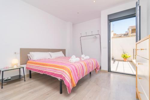 a bedroom with a bed with two towels on it at Marte in Sa Pobla