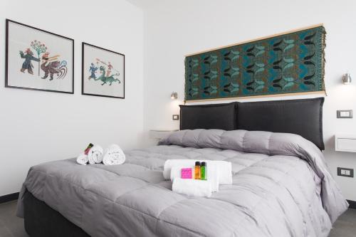 A bed or beds in a room at My Way - Rooms - Palazzo San Matteo