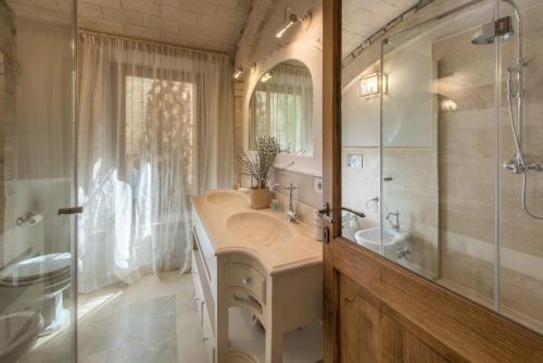 a bathroom with a sink and a shower at Villa Galatea in San Vincenzo