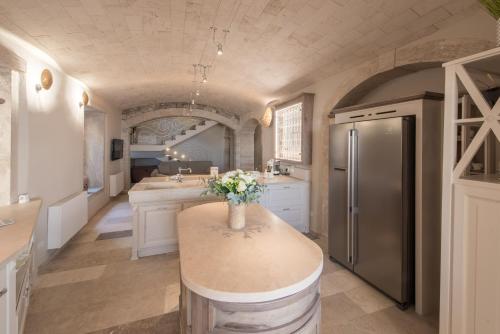 a kitchen with a counter with flowers on it at Villa Galatea in San Vincenzo