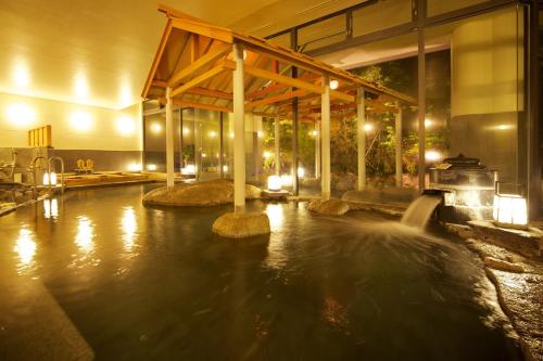 a pool of water in the middle of a building at Dogo Kan in Matsuyama