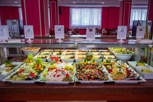 a buffet filled with lots of different types of food at Gran Hotel Peñiscola in Peñíscola