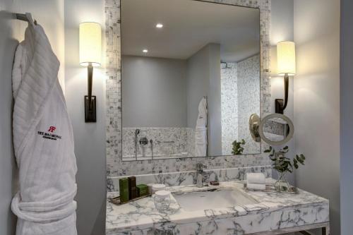 a bathroom with a sink and a mirror at The Balmoral Hotel in Edinburgh
