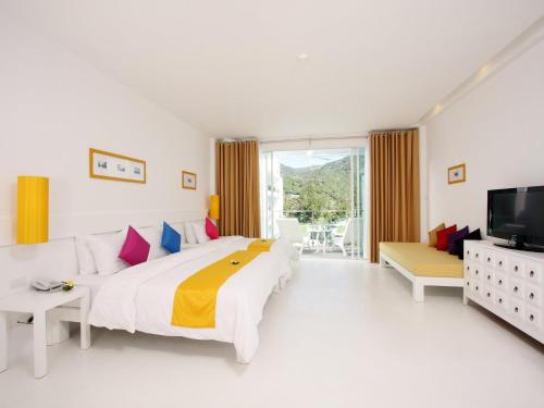 Katil atau katil-katil dalam bilik di The Old Phuket - Karon Beach Resort - SHA Plus