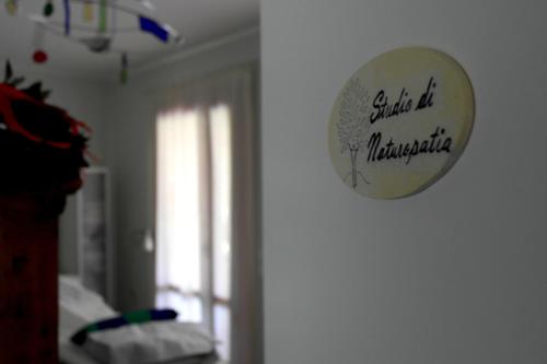 a clock hanging on a wall in a room at B&B Villa Elisa in Motta di Livenza