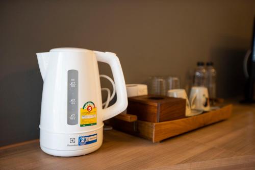 a white blender sitting on top of a table at พรนับพันเพลส in Chiang Mai
