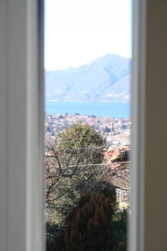 a view of a city and a lake from a window at Villa dei Fiori in Luino