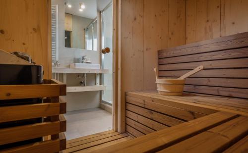a bathroom with a tub and a sink at Demänová Rezort in Liptovský Mikuláš