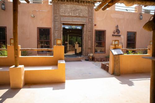 an entrance to a building with a large doorway at Telal Resort Al Ain in Al Ain