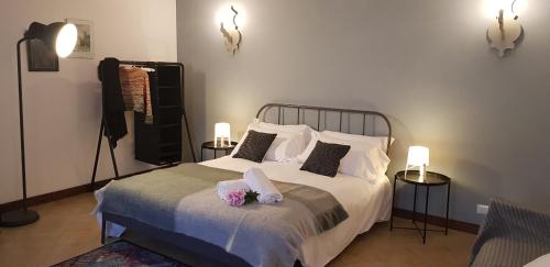Postel nebo postele na pokoji v ubytování Chalet nelle vigne