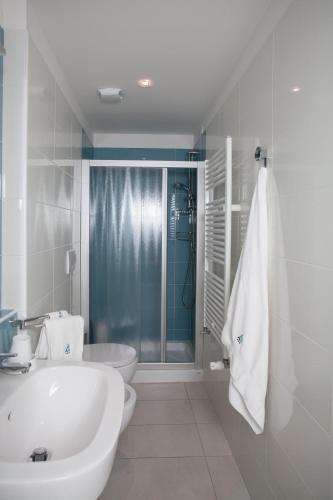 a bathroom with a sink and a toilet and a shower at Hotel Albatros 3 Stelle Superior in Lido di Jesolo