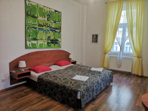 מיטה או מיטות בחדר ב-Auspicie Apartment