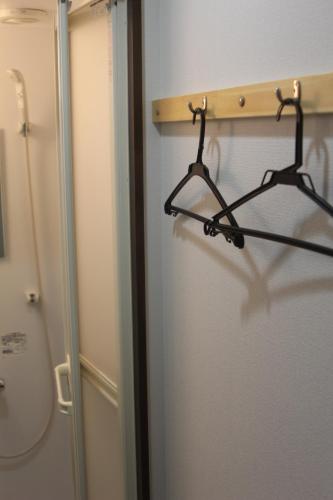 a towel rack on the side of a refrigerator at Shaq Bighouse in Kanazawa