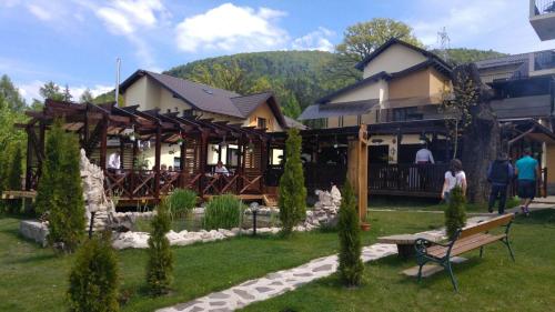 a building with people standing outside of it at 3 Stejari Brasov in Braşov