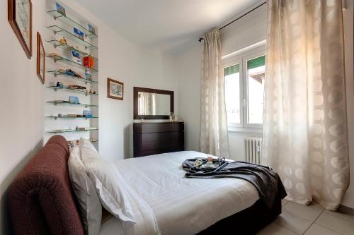 Säng eller sängar i ett rum på Mamo Florence - Binario9 Terrace Apartment