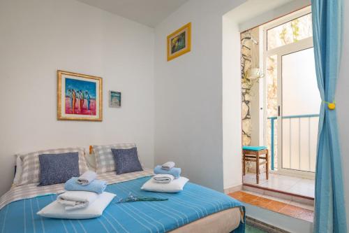 a bedroom with a bed with two pillows on it at Guest house Ivona in Split