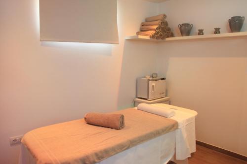 a small room with a table and a small tv at Riva di Ugento Beach Camping Resort in Ugento