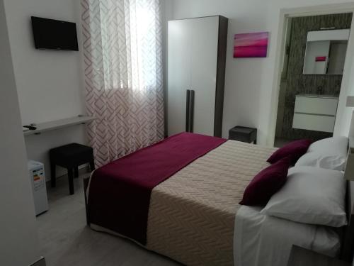 Ένα ή περισσότερα κρεβάτια σε δωμάτιο στο Flamingo Rooms