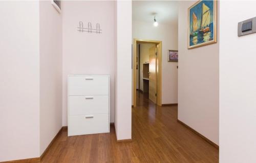 a hallway with white walls and a wooden floor at Villa Vesna in Preko