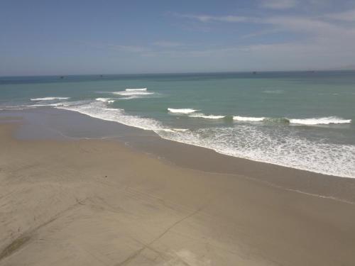 an aerial view of a beach with the ocean at Mangata in Lobitos