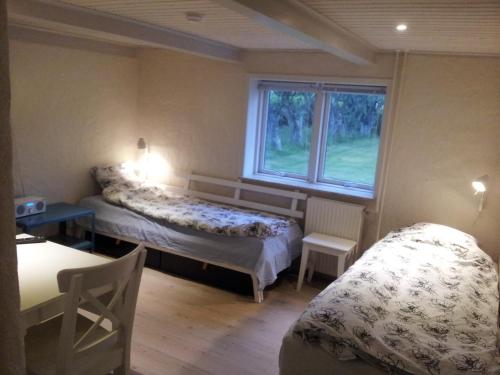 Кровать или кровати в номере Lilleledgaard Apartment
