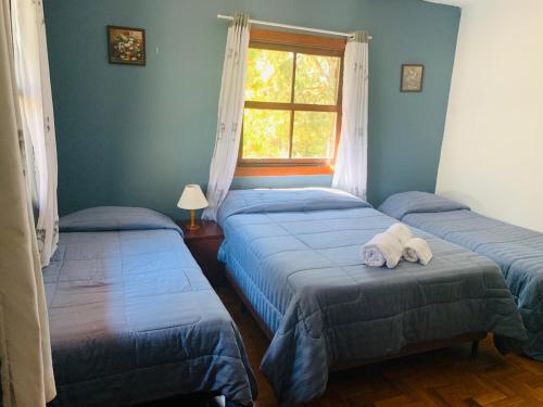 Cama ou camas em um quarto em Hotel Refúgio Alpino