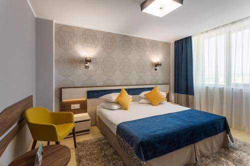 Splendid Conference & Spa Hotel – Adults Only tesisinde bir odada yatak veya yataklar