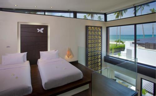 Tempat tidur dalam kamar di Aava Resort and Spa