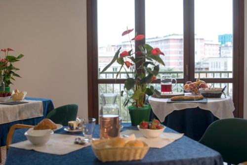 a table with a blue table cloth with food on it at Casa Al Carmine in Padova
