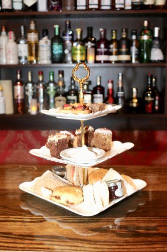 two plates of food sitting on top of a table at Selkirk Arms Hotel in Kirkcudbright