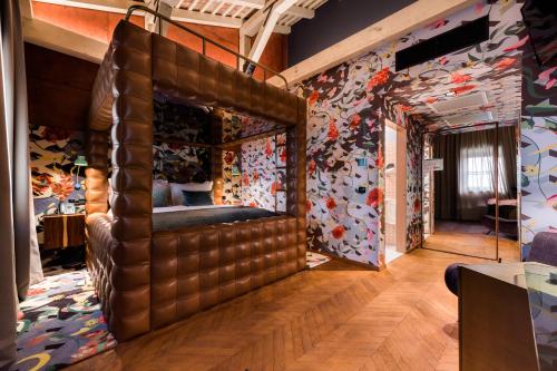 a room with a bed in the middle of a room at Winery & Design hotel ROXANICH in Motovun