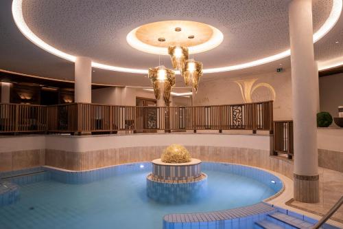 a pool in the lobby of a hotel at Superior Hotel Post Ischgl in Ischgl