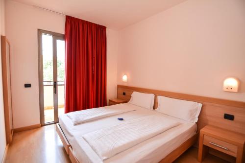 Ένα ή περισσότερα κρεβάτια σε δωμάτιο στο Residence Lido Hotel