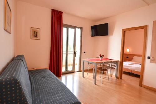 Ένα ή περισσότερα κρεβάτια σε δωμάτιο στο Residence Lido Hotel
