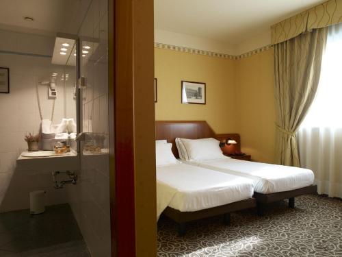 Lova arba lovos apgyvendinimo įstaigoje Hotel Montini Linate Airport
