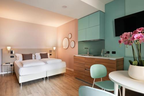 Ένα ή περισσότερα κρεβάτια σε δωμάτιο στο Residence Lido Hotel