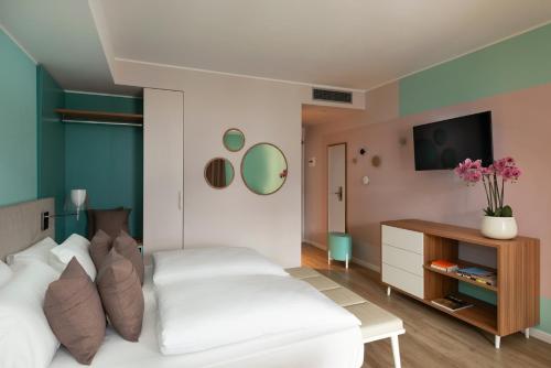 En eller flere senge i et værelse på Residence Lido Hotel