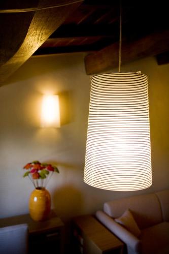 a large white light fixture in a living room at Country House Casco Dell'Acqua in Trevi