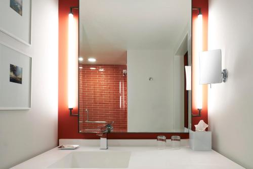 a bathroom with a sink and a mirror at Park MGM Las Vegas in Las Vegas