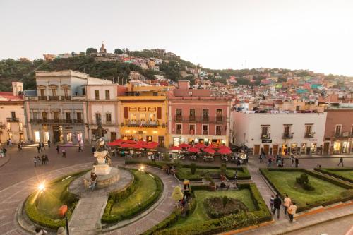 a view of a city with people walking around at Hotel de la Paz in Guanajuato