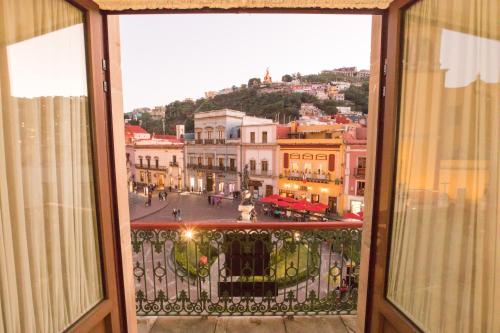 a view of a city from a window at Hotel de la Paz in Guanajuato