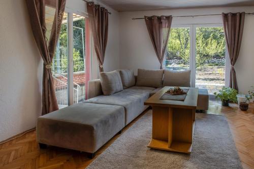 a living room with a couch and a table at Villa Ella in Ohrid