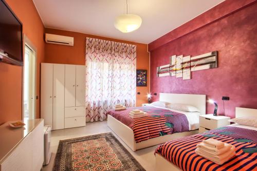 Een bed of bedden in een kamer bij La Collina dei Ciliegi