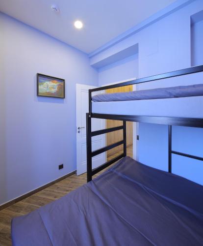 Cama o camas de una habitación en Highland Hostel