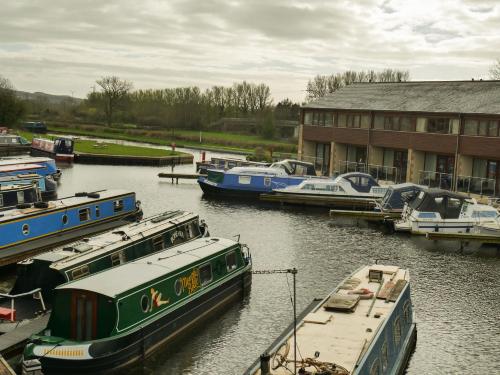 a group of boats are docked in a marina at Tewitfield Marina in Carnforth