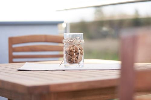 a glass jar filled with nuts on top of a table at Weinhof - Gästehaus Maier in Angern