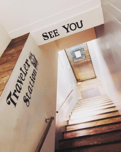 a staircase with a sign that reads see you next to it at Traveler Station R15 in Kaohsiung