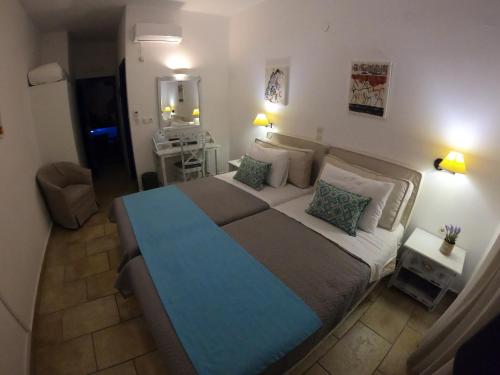 Ένα ή περισσότερα κρεβάτια σε δωμάτιο στο Hotel Mathios
