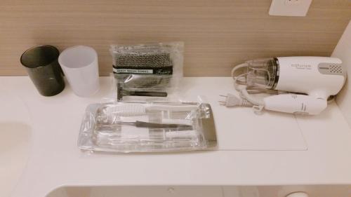a counter top with a blender and other items on it at Sakura Terrace in Kyoto